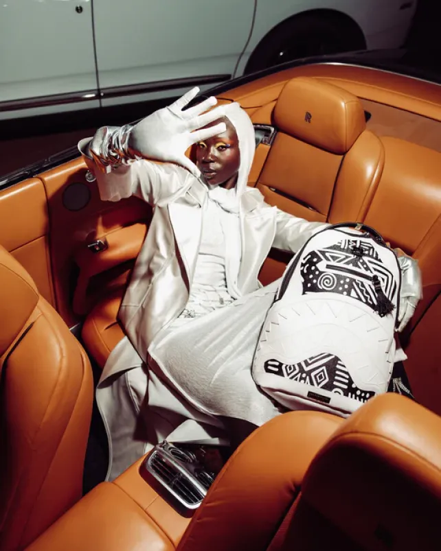 BACKPACKS>SPRAYGROUND A.I.8 AFRICAN INTELLIGENCE - ORIGIN STORY BACKPACK (DLXV)