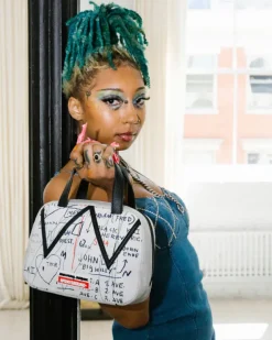 HANDBAGS>SPRAYGROUND OFFICIAL BASQUIAT UNTITLED (CHEESE POPCORN) 1983 HANDBAG