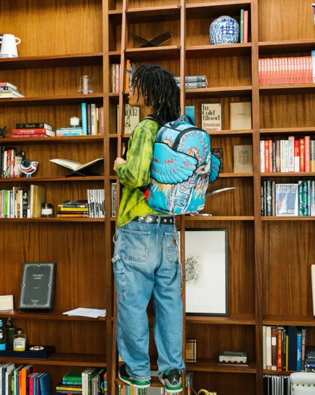 BACKPACKS>SPRAYGROUND OFFICIAL BASQUIAT UNTITLED (FALLEN ANGEL) 1981 WING BACKPACK (DLXV)
