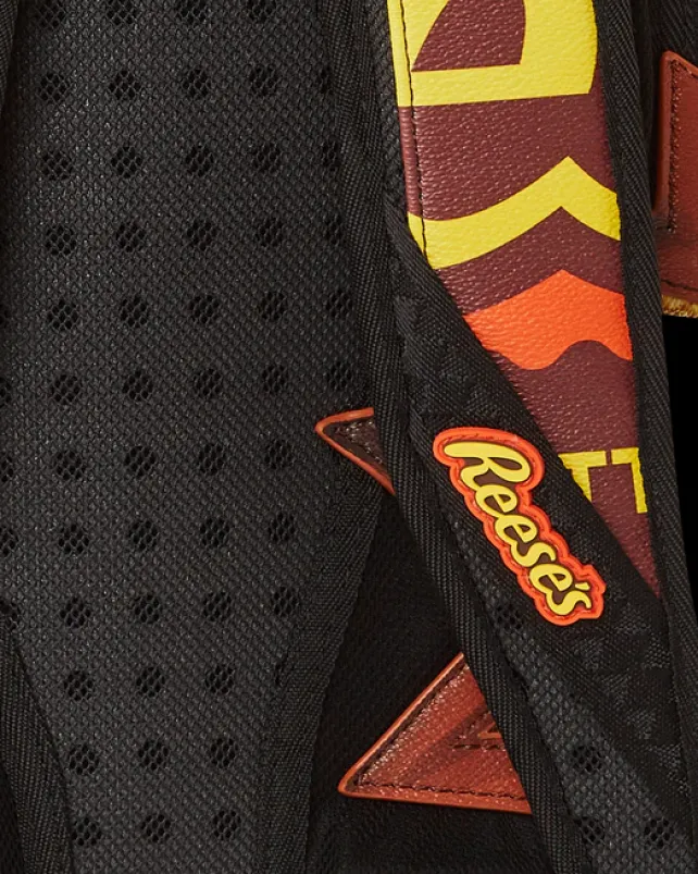 BACKPACKS>SPRAYGROUND REESE'S SHARK BITE BACKPACK (DLXV)