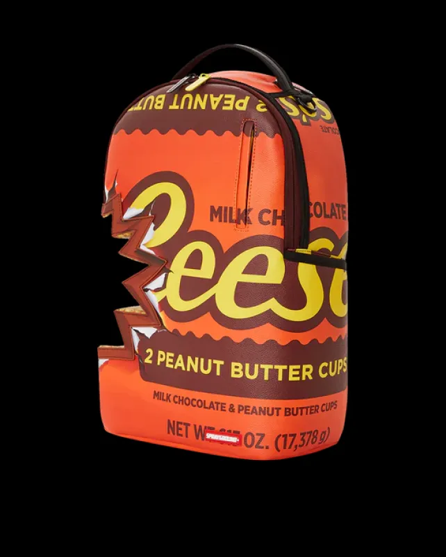 BACKPACKS>SPRAYGROUND REESE'S SHARK BITE BACKPACK (DLXV)