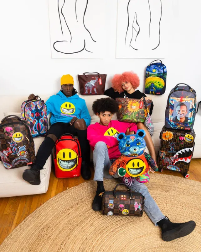 BACKPACKS>SPRAYGROUND SMILE BIG GRIN RON ENGLISH COLLAB